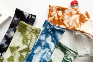 Detailed view of women colorful tie-dye mid-calf socks with retro ink printed style.