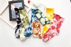 Detailed view of colorful tie-dye crew socks featuring retro ink patterns and soft cotton fabric.