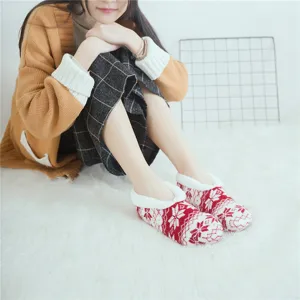 Cozy red and white fleece-lined fuzzy floor socks with winter snowflake pattern for indoor use.
