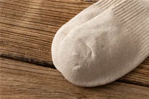 Close-up detail view of thick terry knit cotton men socks showing soft breathable texture.