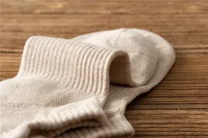Close-up detail of thickened men's cotton athletic towel bottom sock showing rib texture.