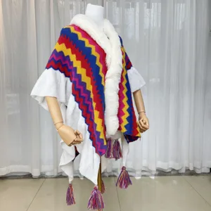 Colorful knitted chevron pattern poncho detail, white faux fur collar and tassels fringe.