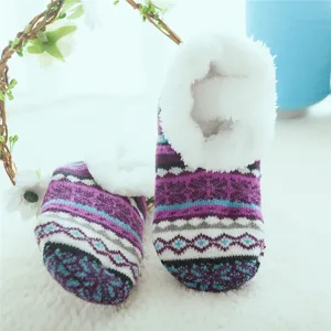 Cozy fleece-lined knit indoor floor socks and slippers for warm winter home comfort.