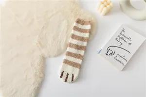 Cozy coral fleece cat paw sock detail view, soft striped winter home sleep sock close up.