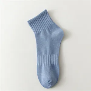 Men's summer mid-tube cotton casual sports socks in light blue breathable ribbed design.