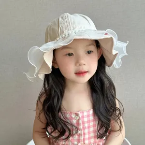 Cute baby sun hat with white lace ruffles and pearls, breathable cotton toddler bucket hat.