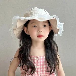 Detailed view of the cute baby princess sun hat with delicate ruffles worn by a child.