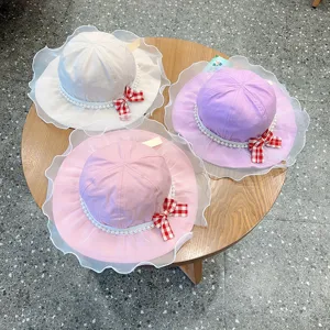 Detailed view of cute kids sun hats with mesh lace pearls and bow design, colorful set.