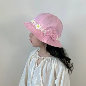 Cute pink kids bucket hat with floral lace trim and sweet bow design for little girls sun protection.