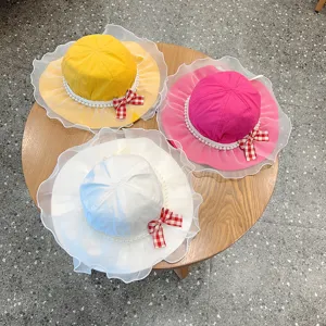 Cute kids sun hat with lace brim pearl trim and plaid bow, vibrant color detail display.