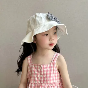Toddler white bucket hat with houndstooth bow detail, cute baby girl spring sun protection hat.