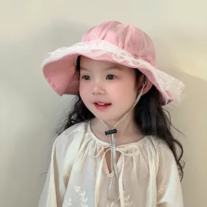 Cute pink baby bucket hat with white lace trim and adjustable strap for toddler girls summer