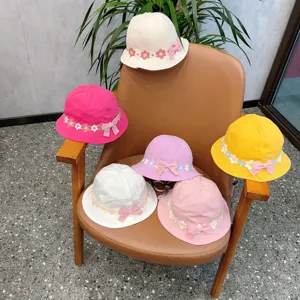 Cute floral lace baby bucket hat detail, soft cotton sun protection hat with bow.