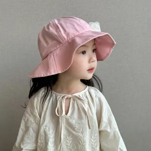 Cute pink baby bucket hat with lace flower detail, perfect spring sun hat for little girls.