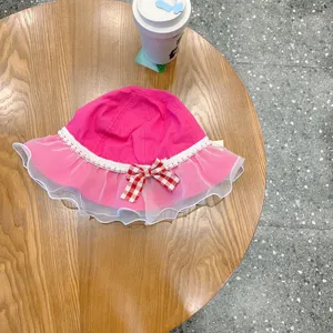 Cute baby pink fisherman hat with mesh lace and bow, perfect toddler sun hat for girls.