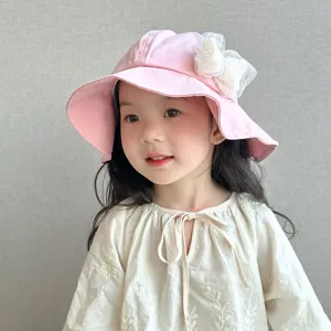 Details of the cute kids pink bucket hat featuring a white mesh bow, soft and comfortable.