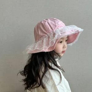 Detailed view of cute toddler pink sun hat with white mesh lace brim, perfect for little girls.
