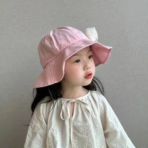 Cute baby girl pink bucket hat with delicate lace flower decoration for spring sun protection.