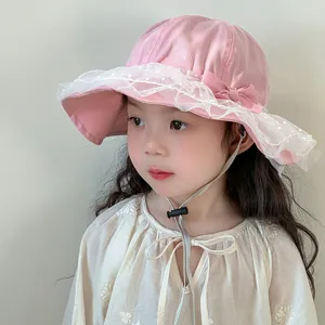 Cute baby girl pink sun hat with white lace trim and adjustable chin strap detail.