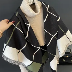 Detail view of black white and green colorblock tassel cashmere feel square shawl.