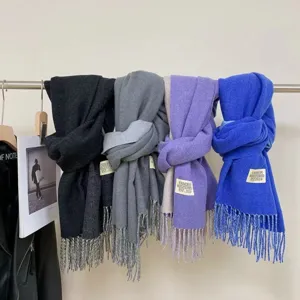 Detail view of winter imitation cashmere scarf solid color warm cozy neck wrap accessory
