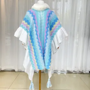 Knitted poncho cape with colorful chevron stripes, faux fur collar, and stylish fringe tassels.