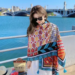 Detailed view of bohemian ethnic geometric printed tassel shawl, outdoor beach resort style.