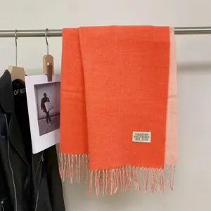 Double-sided imitation cashmere scarf, vibrant orange and pink color block with chic fringe.