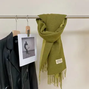 Green double-sided cashmere-feel tassel scarf detail view, elegant autumn and winter neckwear.