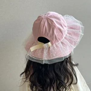 Cute kids pink sun hat with polka dot mesh lace brim and adjustable back strap for girls.