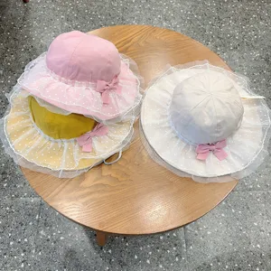 Cute baby lace bucket hat for girls, breathable mesh sun hat with sweet bow design.