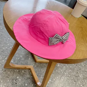 Cute pink kids bucket hat with houndstooth bow, spring sun protection baby basin hat.