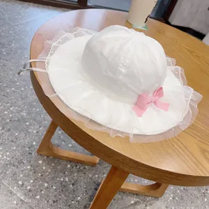 Cute baby sun hat with lace brim and pink bow, lightweight cotton summer hat for girls.