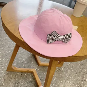 Cute pink baby fisherman hat with houndstooth bow, sweet princess sun hat for little girls.