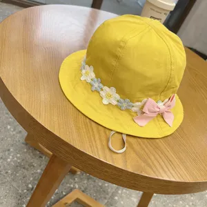 Cute yellow bucket hat for kids with floral embroidery lace and pink bow design adjustable