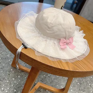 Cute baby bucket hat with mesh lace brim and pink bow, lightweight sun protection for kids.