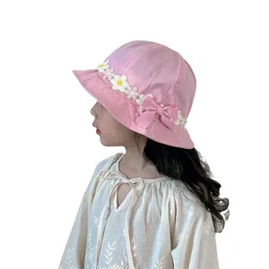 Cute pink kids bucket hat with floral lace and bow, perfect for spring sun protection.
