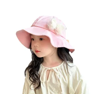 Cute pink children bucket hat with lace bow decoration, perfect spring sun protection for baby girls.