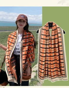 Outdoor model display and detailed close-up of stylish orange plaid scarf and sun hat.