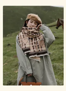 Cozy beige plaid winter scarf with cute heart patterns, soft fringe trim, elegant outdoor look.