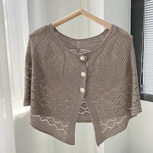 Pearl button hollow knit cape shawl cardigan for women, ideal for spring summer dresses.