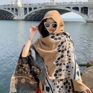 Ethnic floral fringe hooded cape shawl for women, warm winter travel outerwear clothing.
