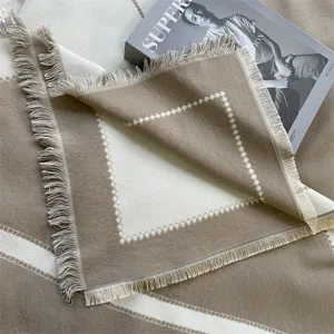 Cashmere-like winter scarf shawl with fringe and geometric pattern for cozy and stylish wear.