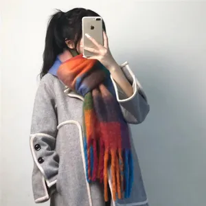 Detailed view of colorful striped thick warm winter scarf, soft cozy rainbow shawl wrap for women.