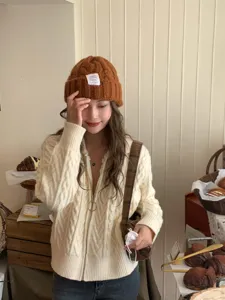 Caramel brown knitted beanie and cream white zip cardigan set, perfect for autumn and winter.