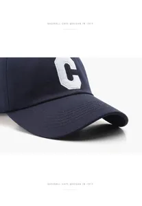 Classic navy blue baseball cap featuring white embroidered letter C for unisex outdoor wear.