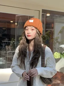 Caramel knit beanie detail view, soft woolen winter warm slouchy hat, cozy daily wear style.