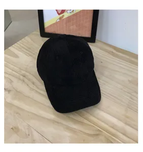 Classic black corduroy baseball cap for women, soft autumn and winter casual dad hat.