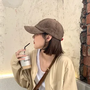 Trendy brown corduroy baseball cap for women, stylish vintage duck tongue hat for casual daily wear.