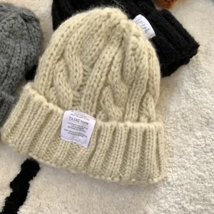 Cozy chunky knit beanie hat for women, winter warm slouchy wool cap with stylish label patch.
